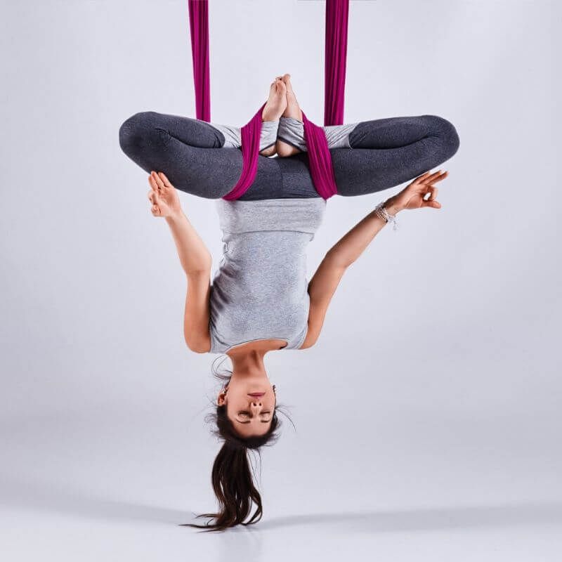 The Best Aerial Yoga Poses to Relieve Back Pain
